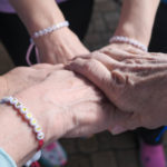ALGSO members joining hands with Team ALGSO bracelets at Run4Cancer 2025 Differdange.