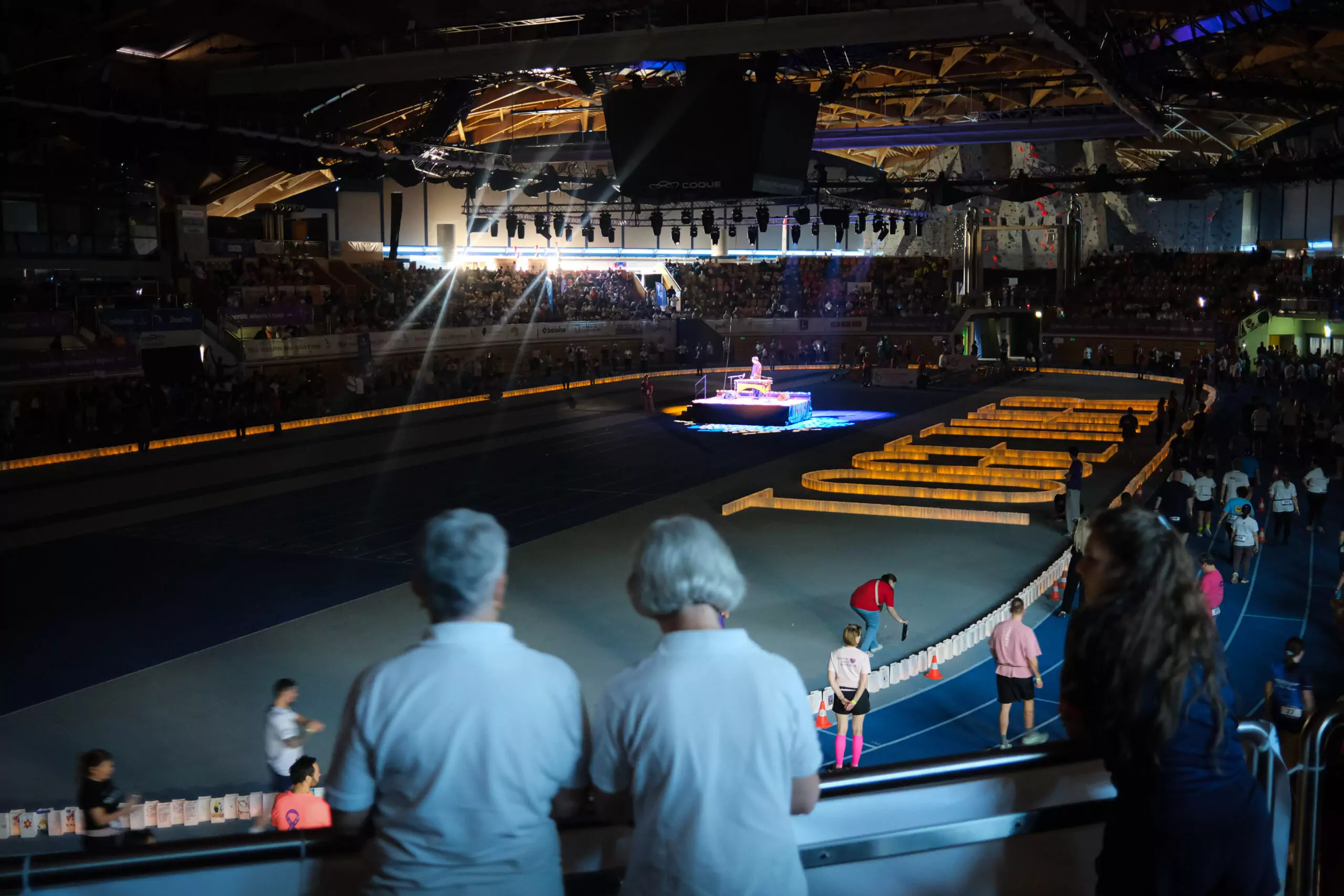 ALGSO members watching the Relais pour la Vie 2026 Candle Ceremony with the word "Together" illuminated.
